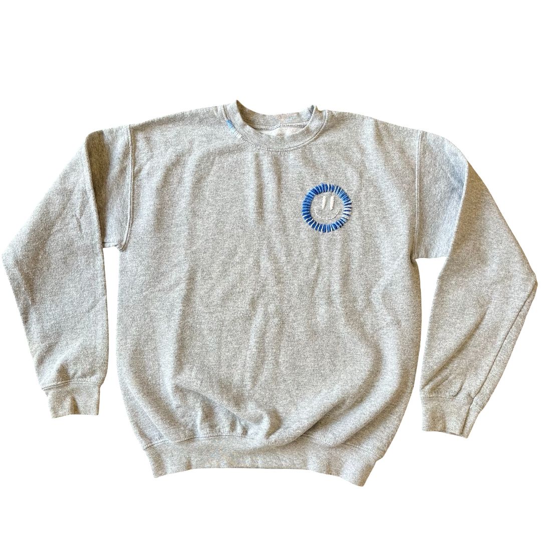 Saavy Society grey w/blue smiley face sweatshirt, youth large