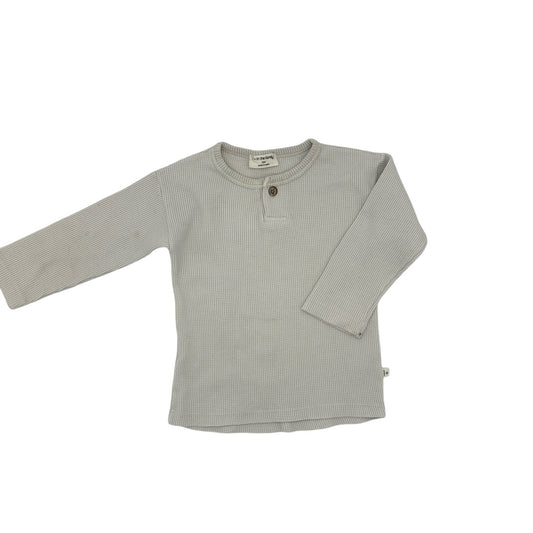 1 + in the Family waffle long sleeve slight stain on left arm, 12 months